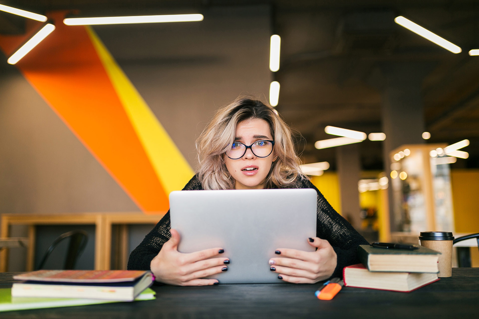 young-woman-working-on-laptop-in-co-working-office-2021-08-30-14-15-16-utc